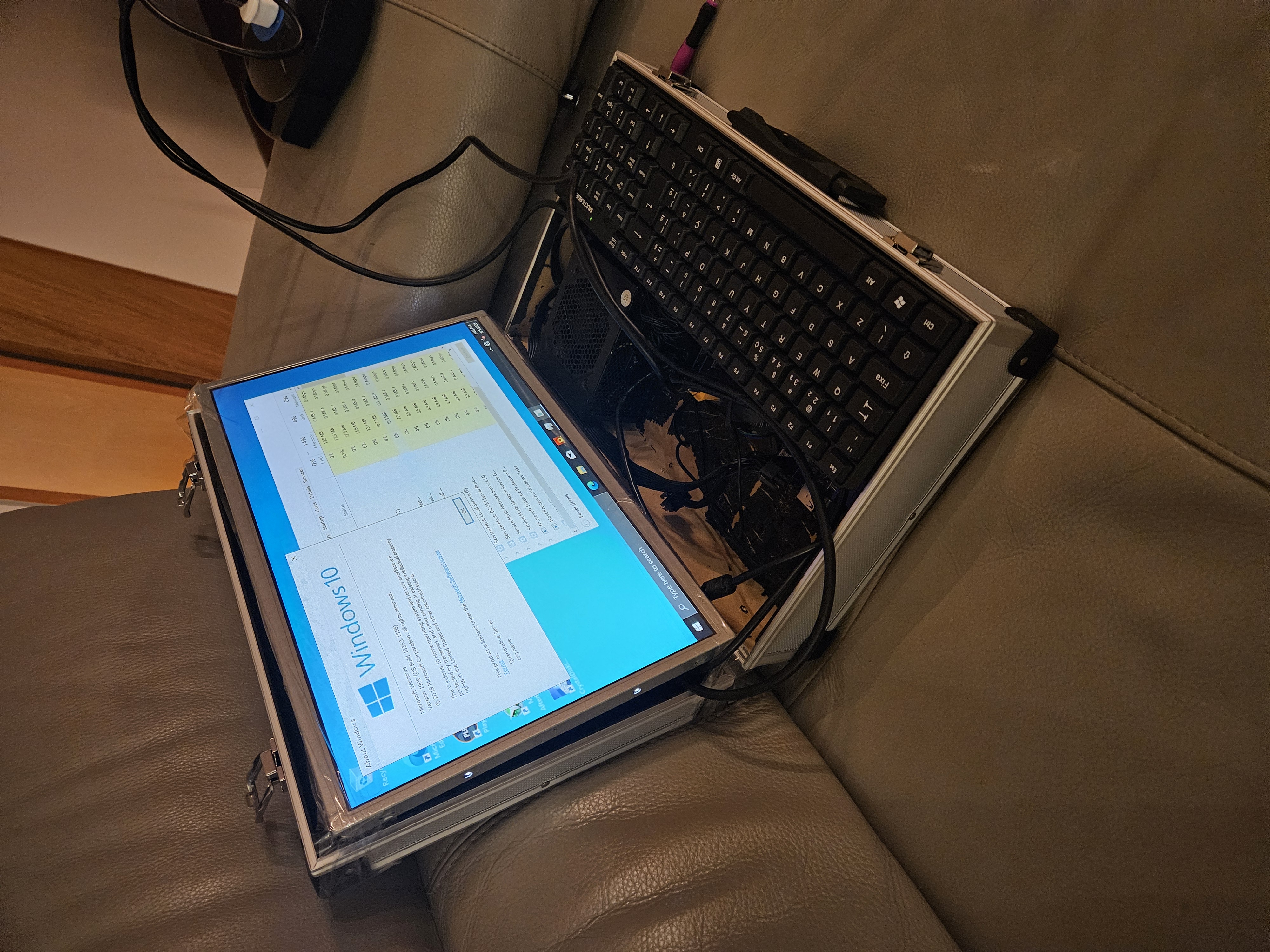 Briefcase laptop build, open showing screen, keyboard, and internals