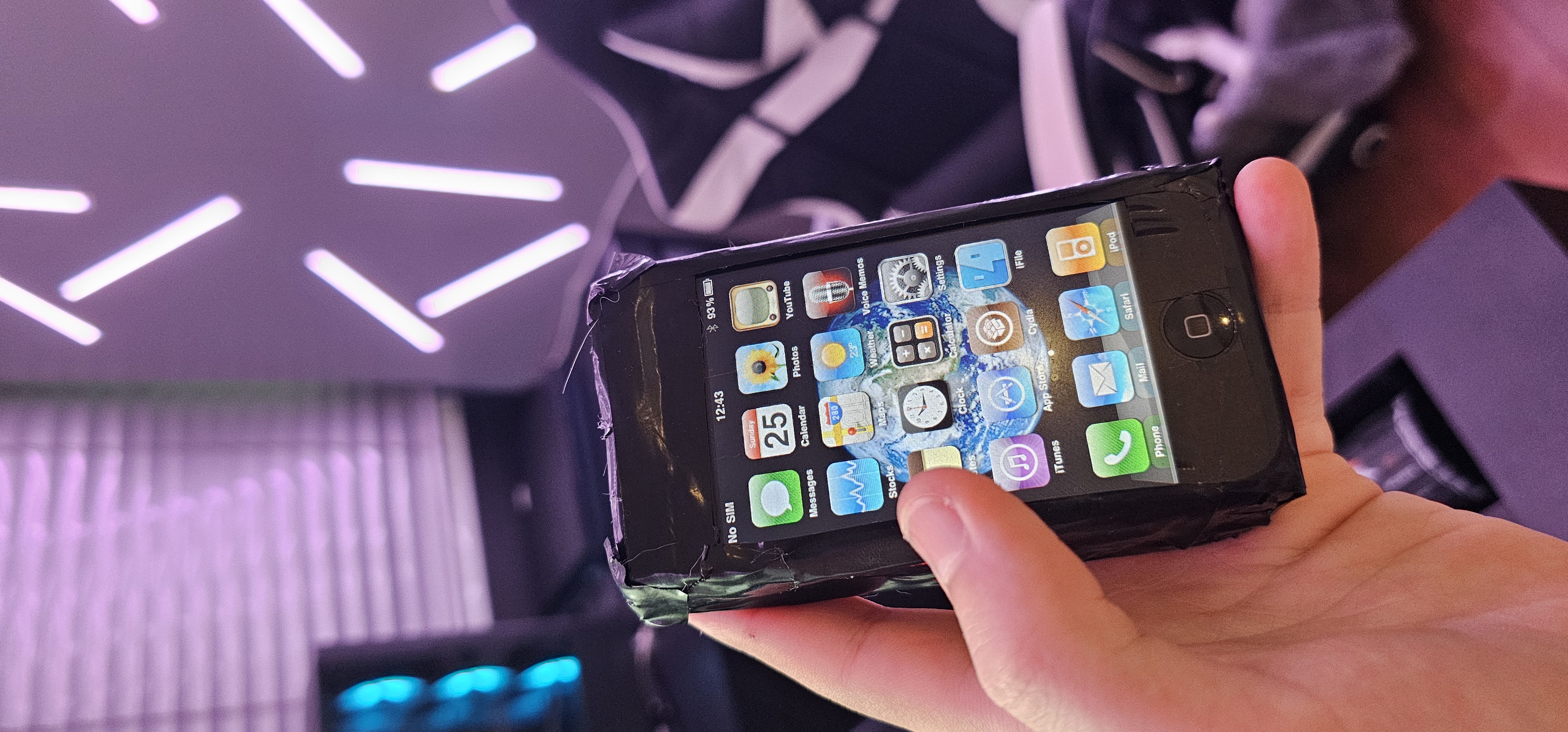 Original iPhone 2G with jailbreak home screen showing Cydia and iFile